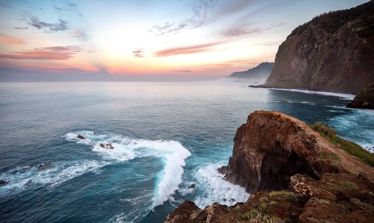 Sunrise over the Atlantic from the cliffs at Miradouro do Guindaste, Madeira